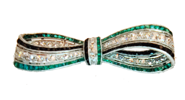 Art Deco bow brooch diamonds, emeralds and onyx.