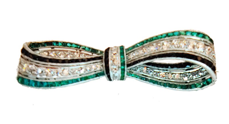 Art Deco bow brooch diamonds, emeralds and onyx.
