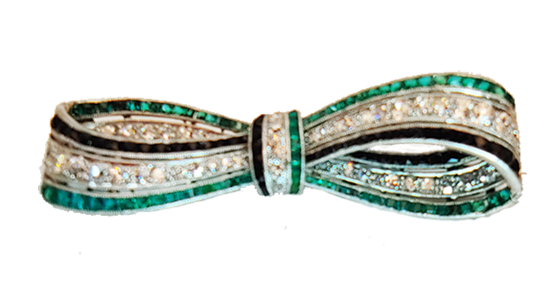 Art Deco bow brooch diamonds, emeralds and onyx.